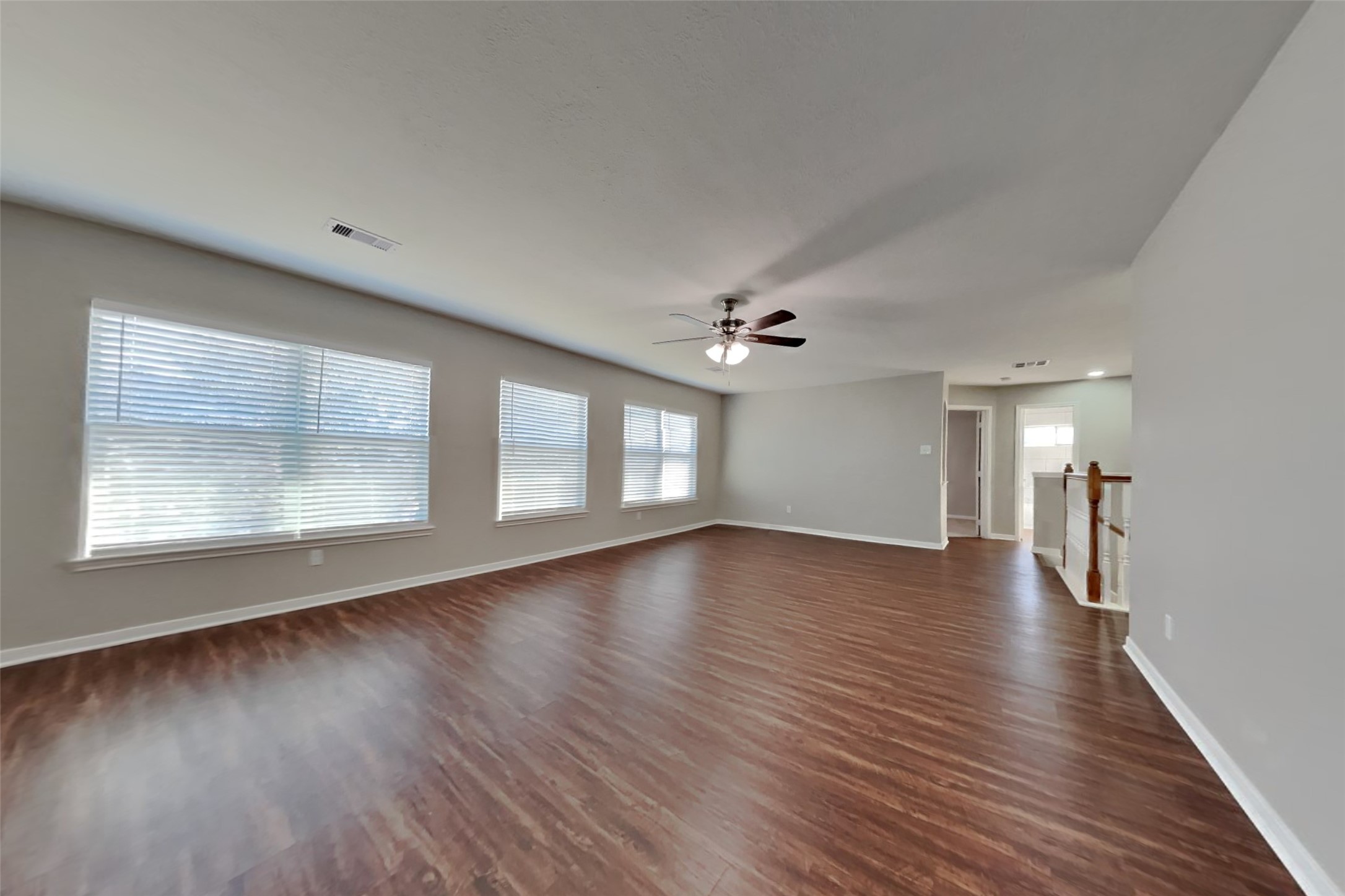 3242 Enchanted Hollow Lane Spring, TX 77388 - Photo 7 of 24 a view of an empty room with wooden floor and a window