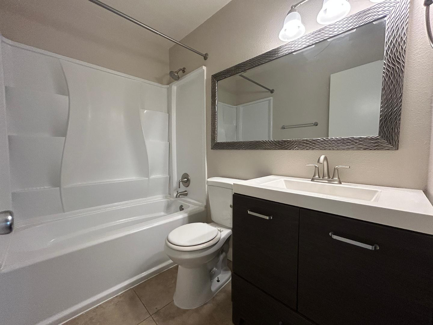 859 South Ext Road Mesa, AZ 85210 - Photo 17 of 19 a bathroom with a sink toilet and shower