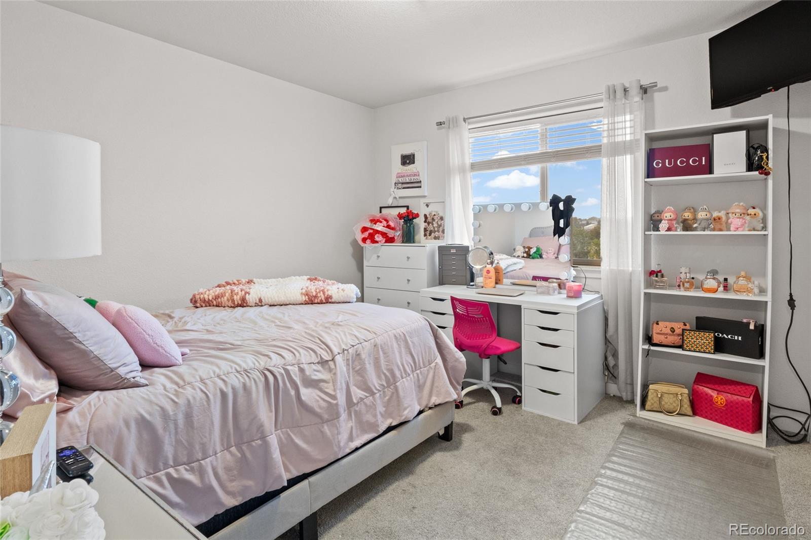 6302 2nd Street Greeley, CO 80634 - Photo 24 of 37 a bedroom with bed and a desk