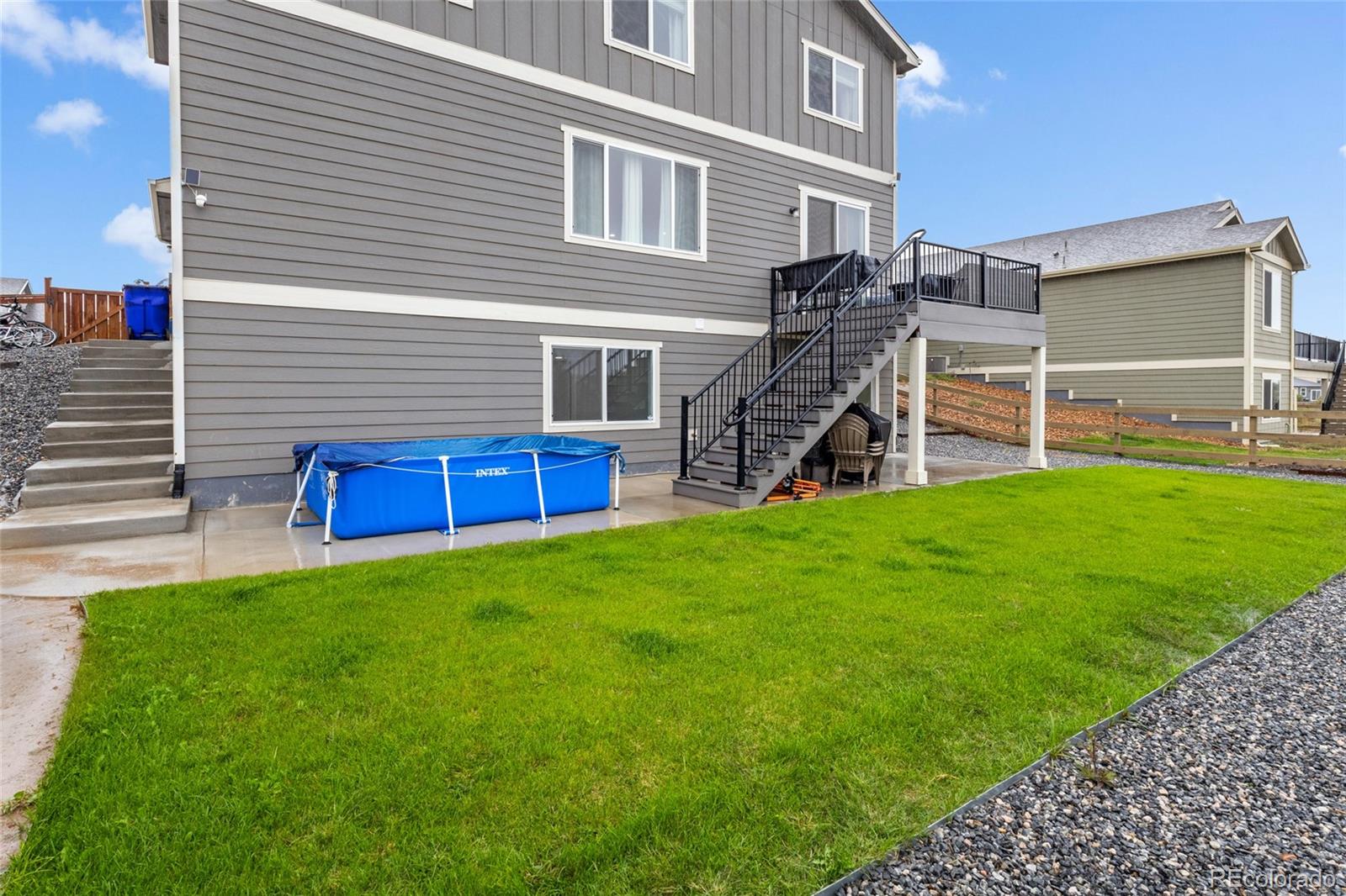 6302 2nd Street Greeley, CO 80634 - Photo 32 of 37 a view of a house with a yard and sitting area