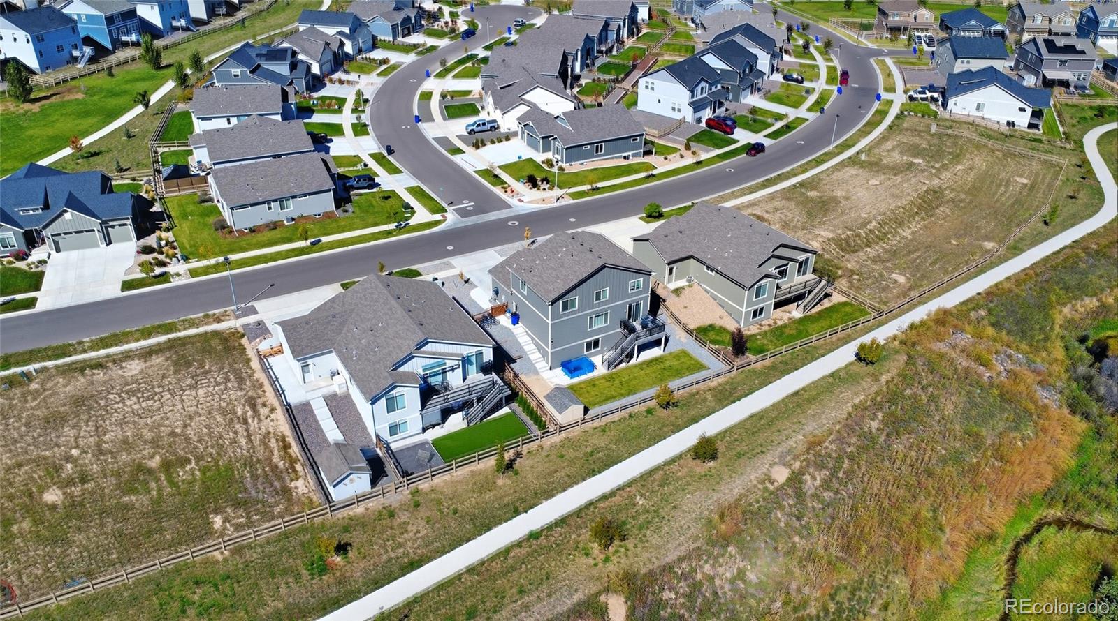 6302 2nd Street Greeley, CO 80634 - Photo 37 of 37 an aerial view of a house with a swimming pool