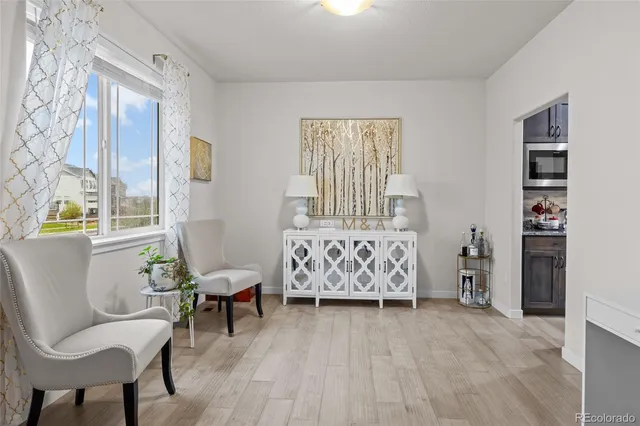 a kitchen with stainless steel appliances granite countertop a sink refrigerator and cabinets