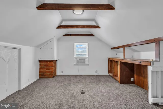 a view of an empty room with stairs