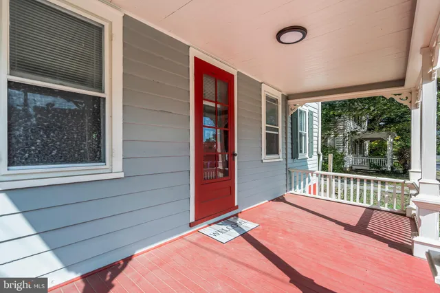 a view of entryway with stairs and wooden floor