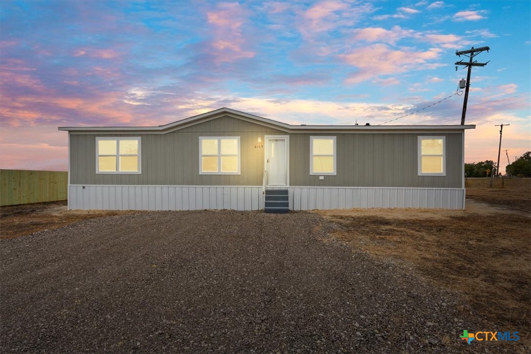 a house view with a garden space