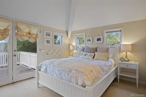 a bedroom with a bed and a night stand