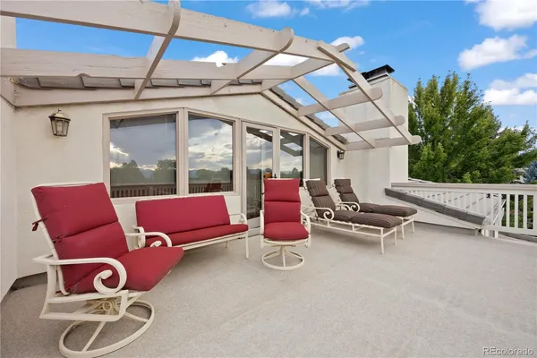 a view of a patio with a table and chairs