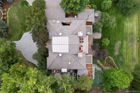 an aerial view of multiple houses with yard