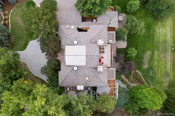 an aerial view of multiple houses with yard