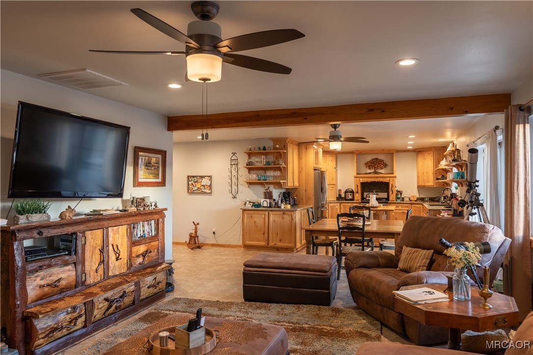 448 Edgemoor Road Big Bear Lake, CA 92315 - Photo 11 of 42 a living room with fireplace furniture and a flat screen tv