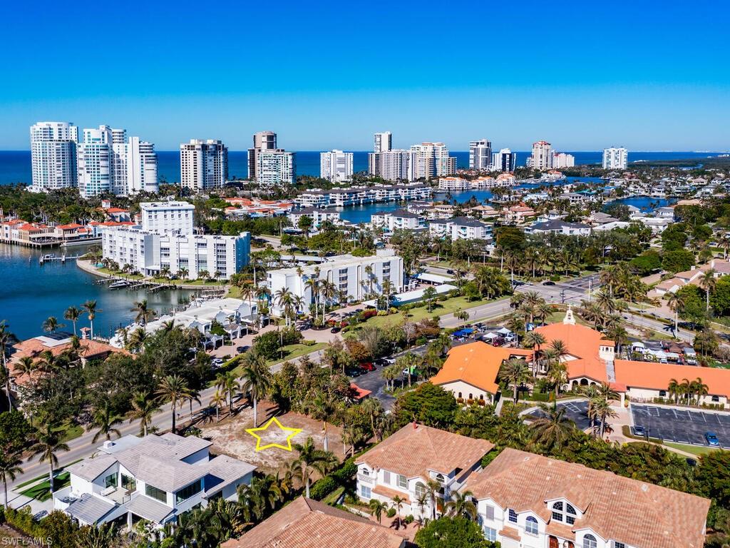 3940 Crayton Road Naples, FL 34103 - Photo 2 of 8 a view of a city