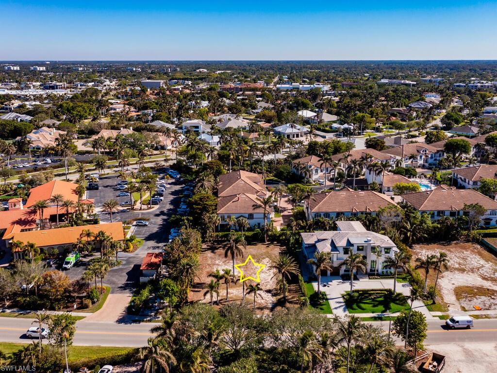 3940 Crayton Road Naples, FL 34103 - Photo 4 of 8 an aerial view of a city