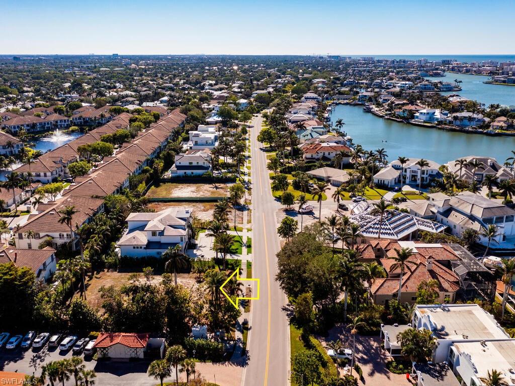 3940 Crayton Road Naples, FL 34103 - Photo 7 of 8 an aerial view of a city