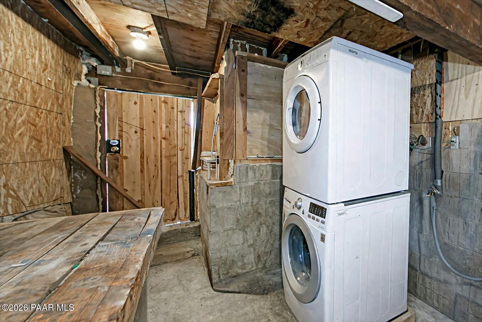 7310 West Hootenanny Road Prescott, AZ 86305 - Photo 14 of 28 basement laundry with workbench
