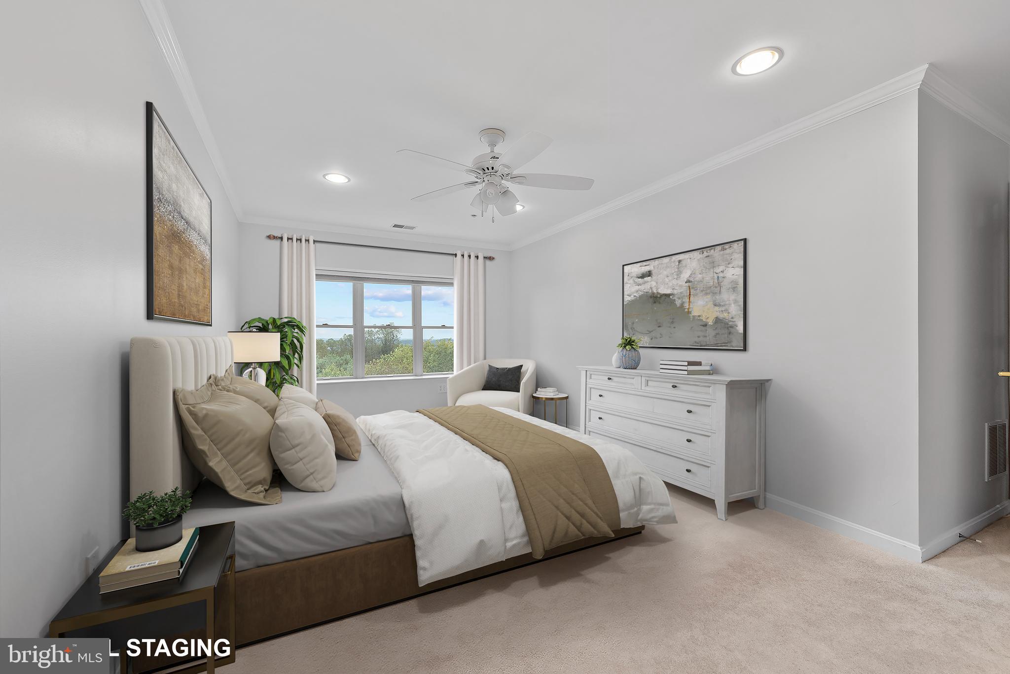 12240 Roundwood Road, Unit 704 Lutherville-Timonium, MD 21093 - Photo 12 of 22 a bedroom with a bed and a flat tv screen on dresser