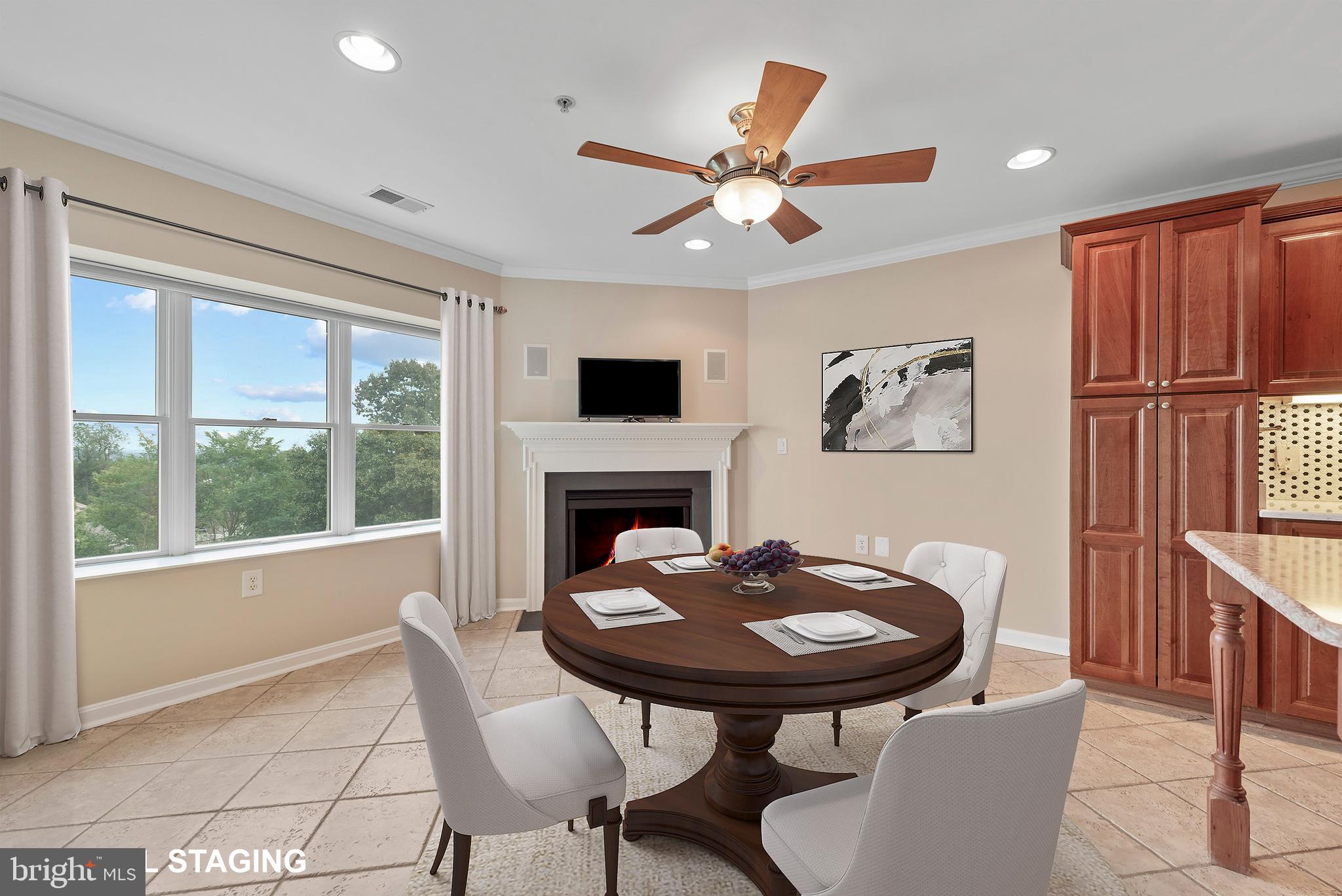 12240 Roundwood Road, Unit 704 Lutherville-Timonium, MD 21093 - Photo 6 of 22 a view of a dining room with furniture window and wooden floor