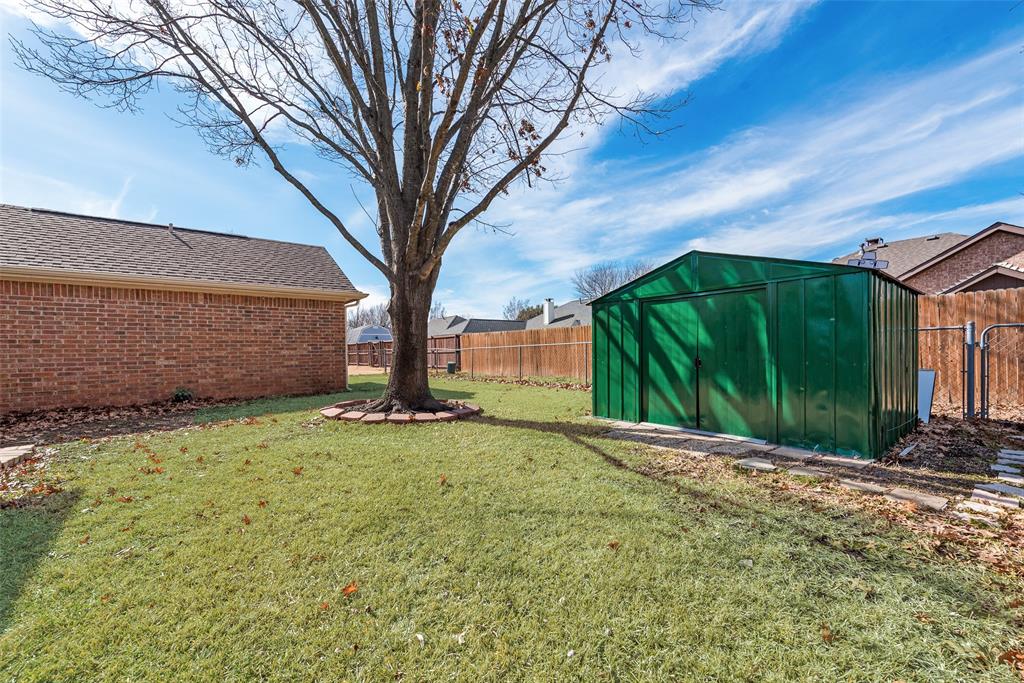 106 Villanova Circle Forney, TX 75126 - Photo 24 of 26 a view of backyard with tree
