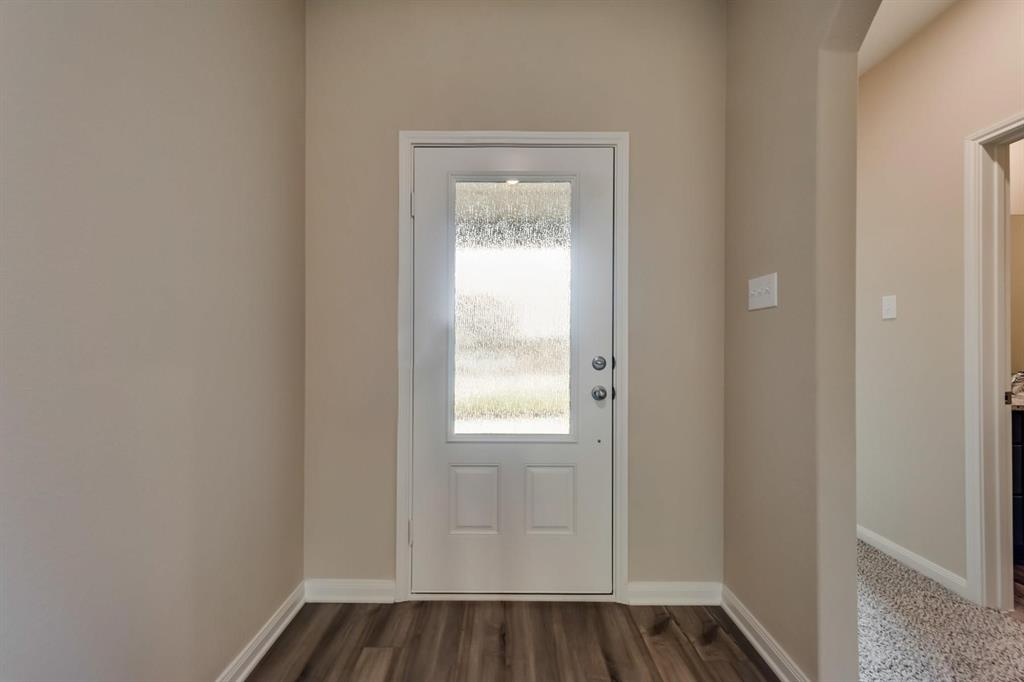 304 Wandering Stream Way Princeton, TX 75407 - Photo 5 of 13 a view of an empty room and window