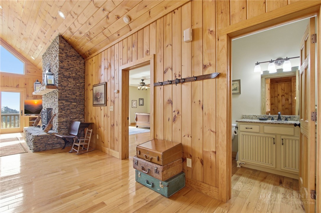 2081 Blackberry Road Boone, NC 28607 - Photo 26 of 45 a living room with furniture a fireplace and a large window