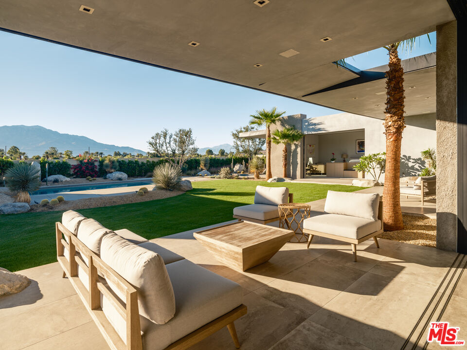3 Echo Lane Rancho Mirage, CA 92270 - Photo 13 of 39 a view of a patio with chairs and table in patio