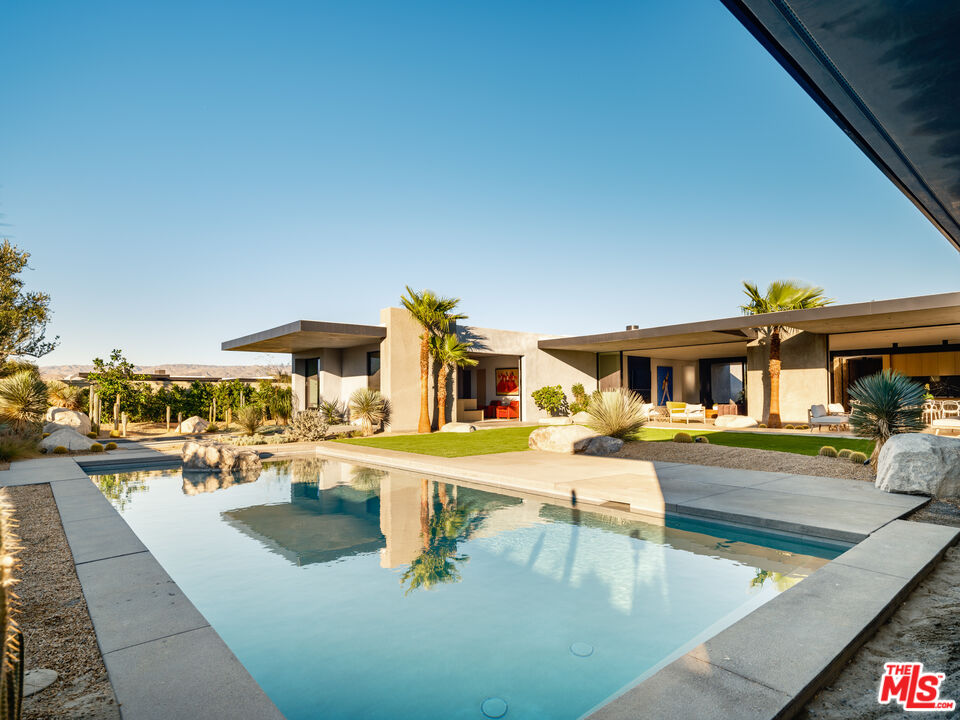 3 Echo Lane Rancho Mirage, CA 92270 - Photo 14 of 39 a view of a swimming pool with outdoor seating