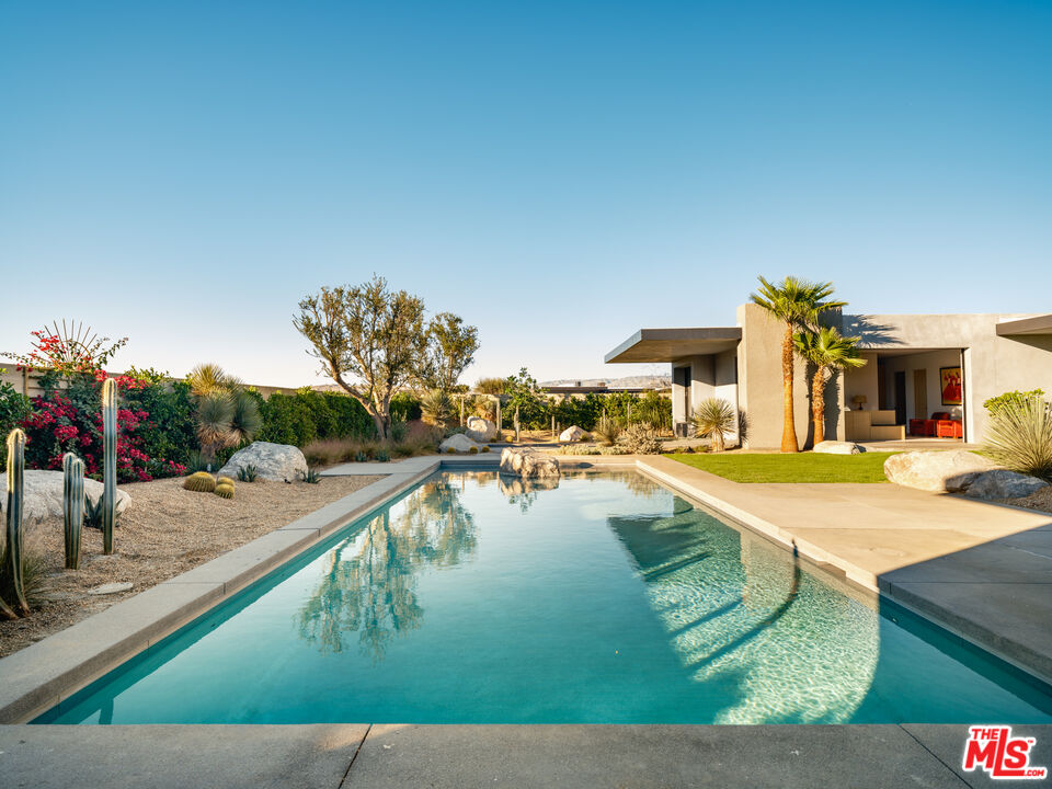 3 Echo Lane Rancho Mirage, CA 92270 - Photo 15 of 39 a view of a swimming pool with an outdoor seating