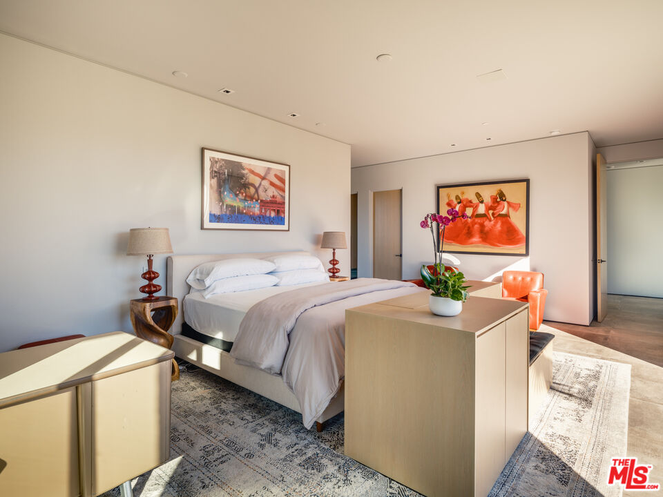 3 Echo Lane Rancho Mirage, CA 92270 - Photo 21 of 39 a bedroom with a bed and a painting on the wall