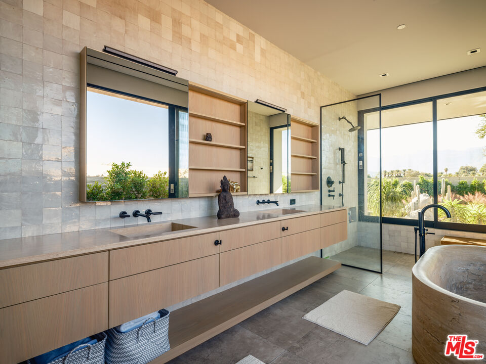 3 Echo Lane Rancho Mirage, CA 92270 - Photo 23 of 39 a large bathroom with a double vanity sink a large mirror and shower
