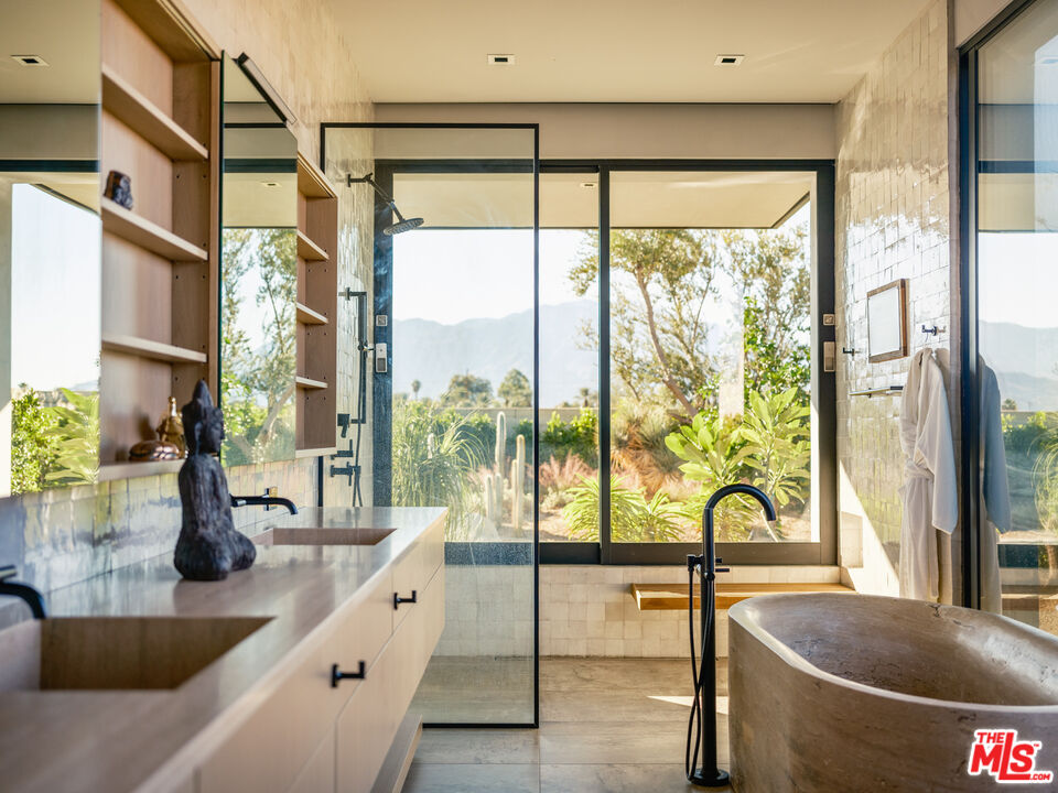 3 Echo Lane Rancho Mirage, CA 92270 - Photo 24 of 39 a kitchen with kitchen island a large window in it