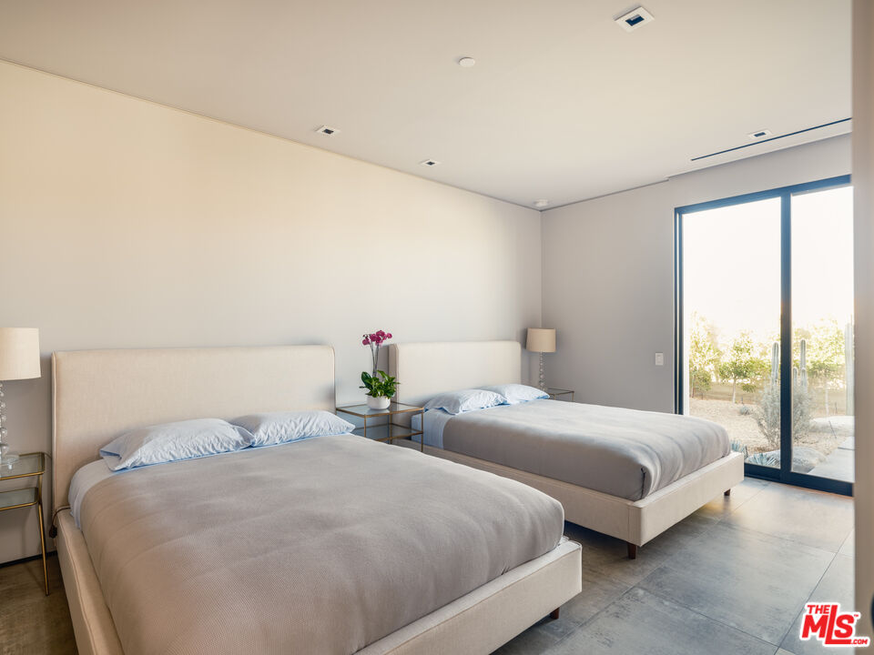 3 Echo Lane Rancho Mirage, CA 92270 - Photo 26 of 39 a bedroom with two beds and large window