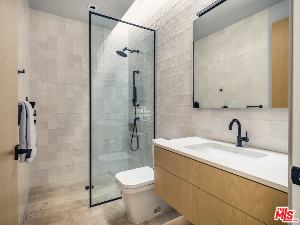 3 Echo Lane Rancho Mirage, CA 92270 - Photo 30 of 39 a bathroom with a sink toilet and shower