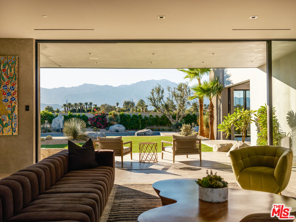 3 Echo Lane Rancho Mirage, CA 92270 - Photo 31 of 39 a living room with furniture and a large window