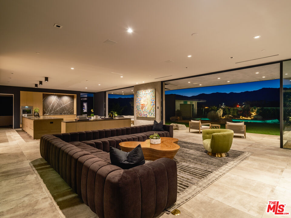 3 Echo Lane Rancho Mirage, CA 92270 - Photo 32 of 39 a living room with furniture and a large window