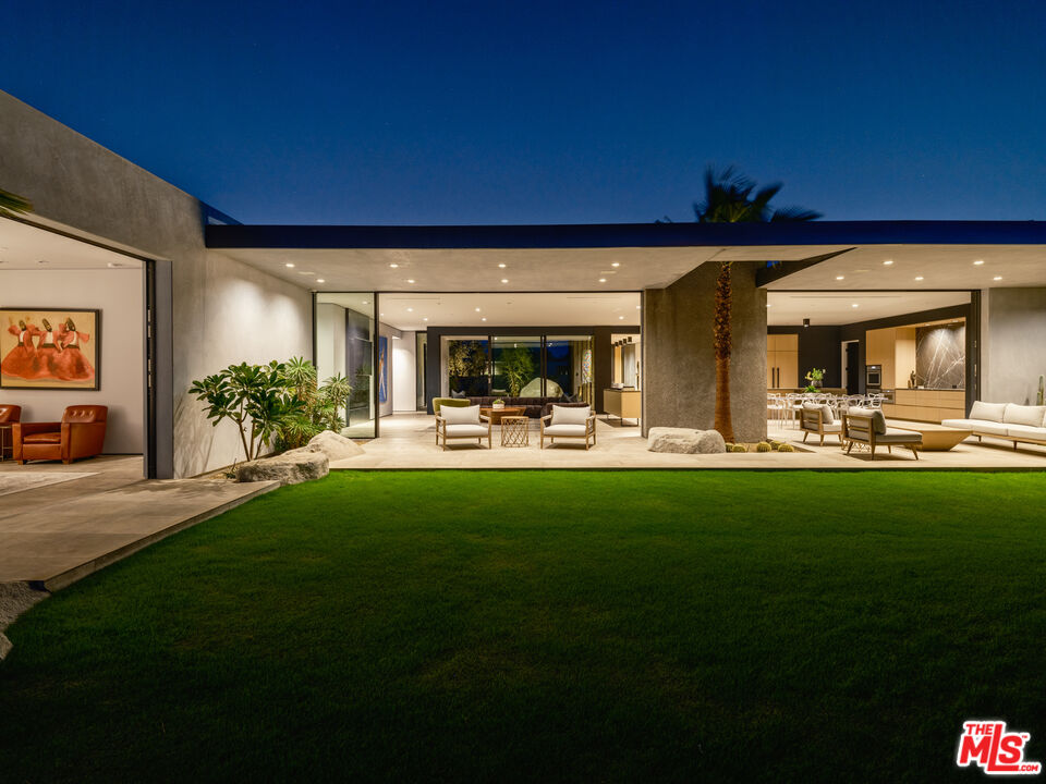 3 Echo Lane Rancho Mirage, CA 92270 - Photo 36 of 39 a swimming pool with outdoor seating and yard