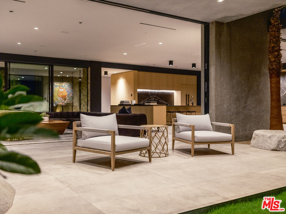3 Echo Lane Rancho Mirage, CA 92270 - Photo 37 of 39 a living room with furniture and a large window