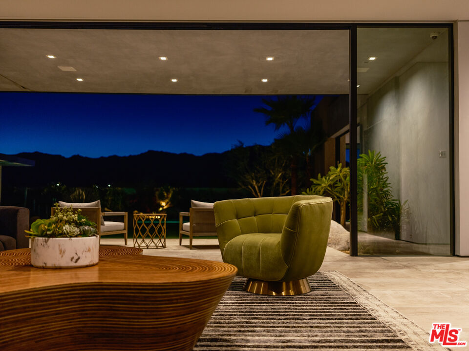 3 Echo Lane Rancho Mirage, CA 92270 - Photo 39 of 39 a living room with furniture and a potted plant
