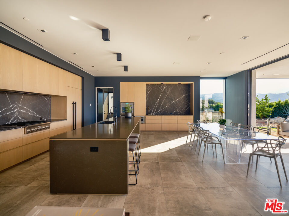 3 Echo Lane Rancho Mirage, CA 92270 - Photo 9 of 39 a dining room with furniture and a large window