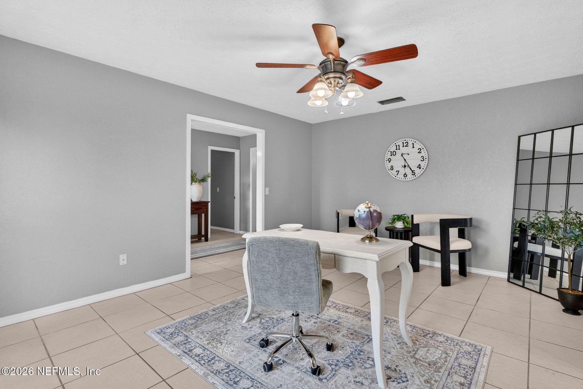 138 Ridgefield Court Orange Park, FL 32065 - Photo 16 of 64 a dining room with furniture and window