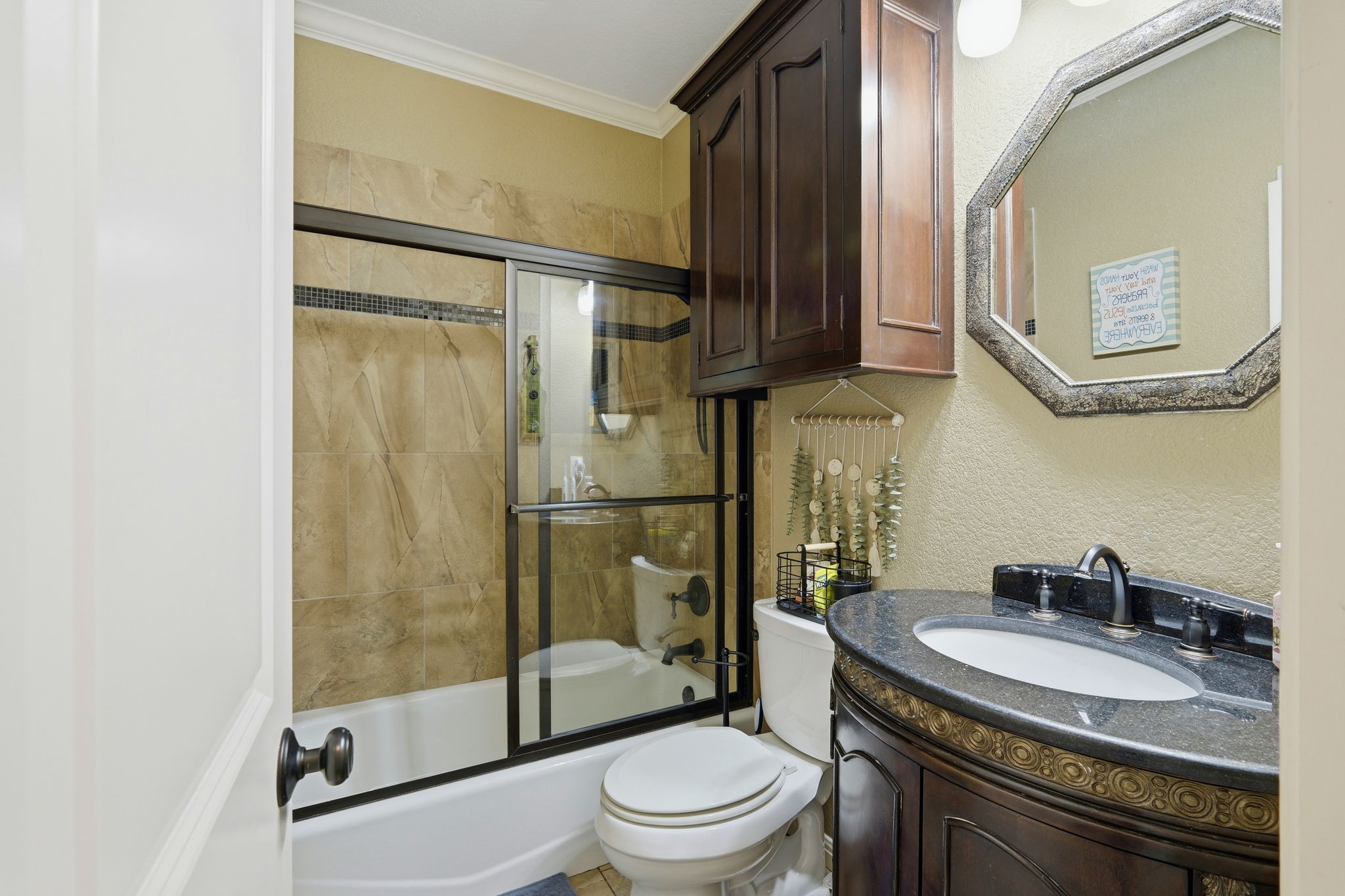 701 County Road 107 Georgetown, TX 78626 - Photo 22 of 30 a bathroom with a granite countertop sink toilet and shower