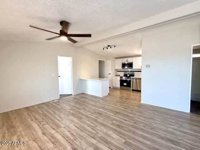 1847 North Warner Drive Apache Junction, AZ 85120 - Photo 6 of 18 a view of a kitchen with wooden floor and a ceiling fan