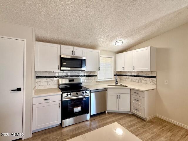 1847 North Warner Drive Apache Junction, AZ 85120 - Photo 7 of 18 a kitchen with a stove a sink and a microwave