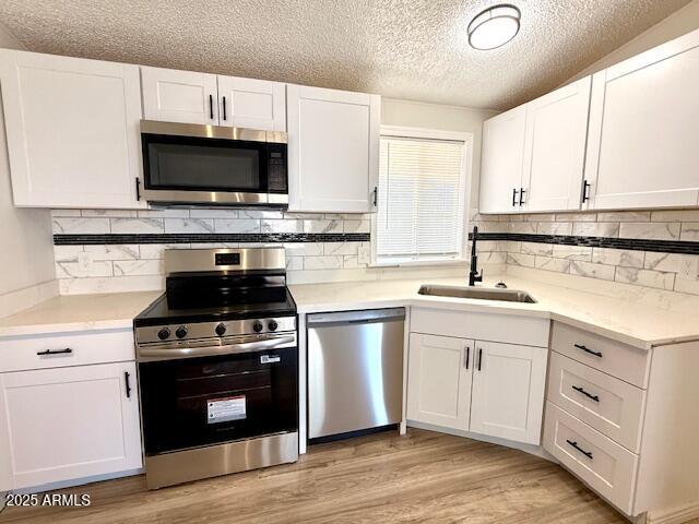 1847 North Warner Drive Apache Junction, AZ 85120 - Photo 8 of 18 a kitchen with cabinets stainless steel appliances a sink and a stove