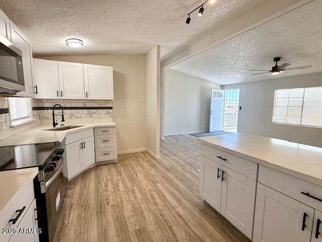 1847 North Warner Drive Apache Junction, AZ 85120 - Photo 9 of 18 a kitchen with stainless steel appliances granite countertop a lot of counter space and wooden floors