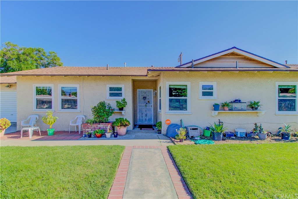 2829 West Union Street Rialto, CA 92376 - Photo 1 of 1 a front view of a house with garden