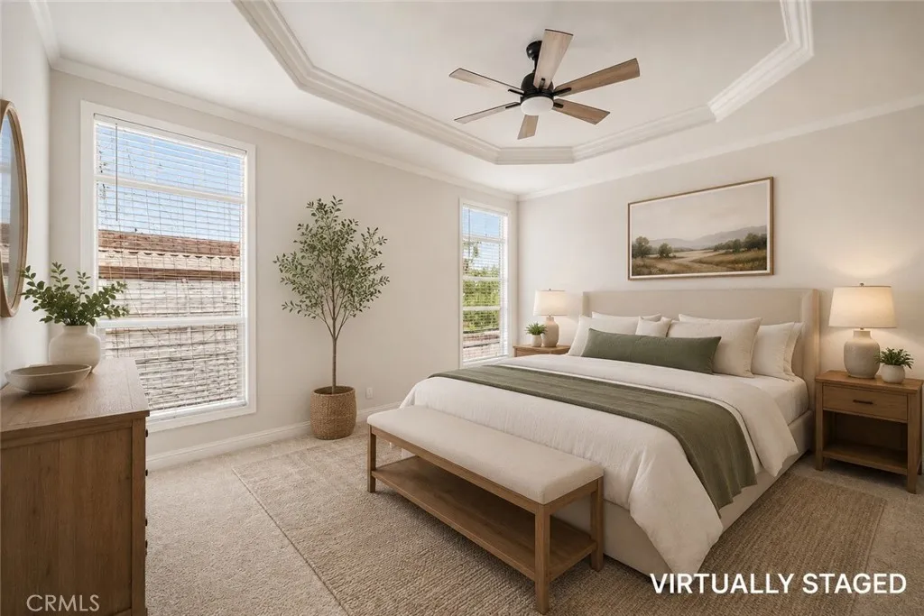 250 East Telegraph Road, Unit 307 Fillmore, CA 93015 - Photo 22 of 36 a spacious bedroom that has a bed and a window