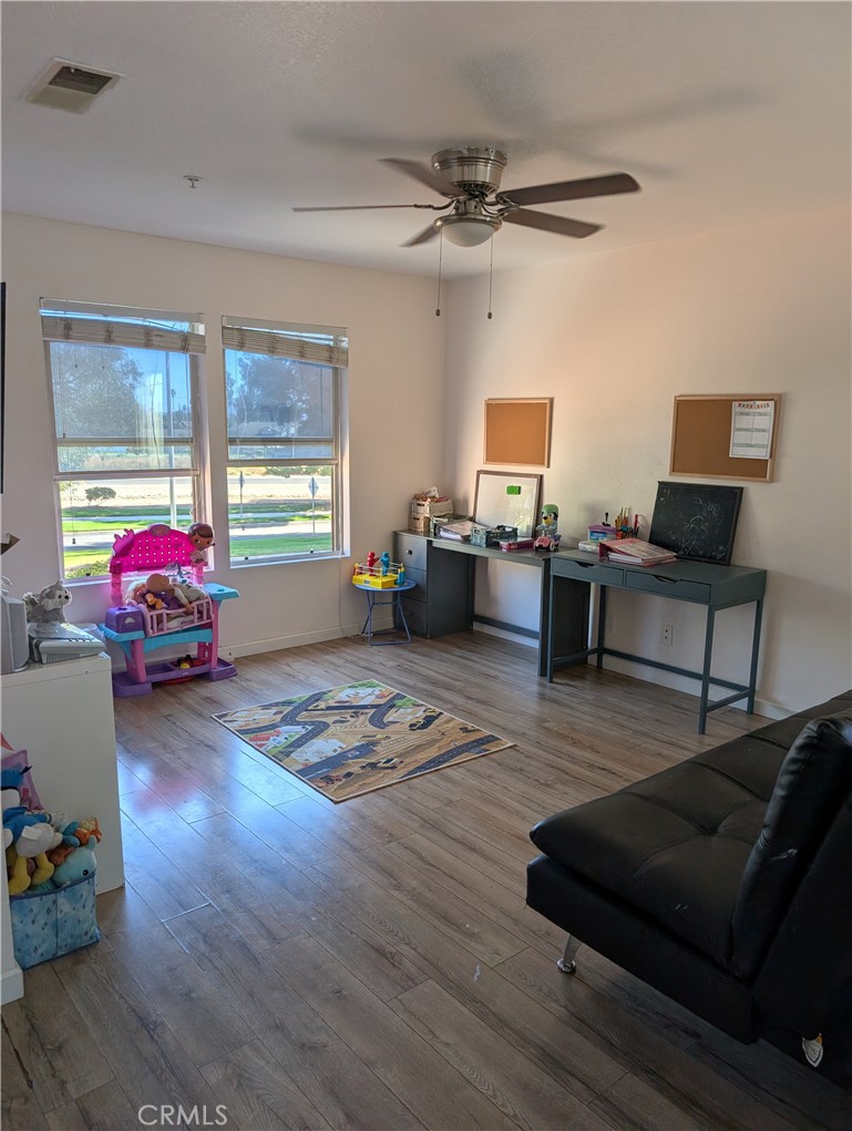 7397 McClellan Court Fontana, CA 92336 - Photo 12 of 14 a living room with furniture and a window