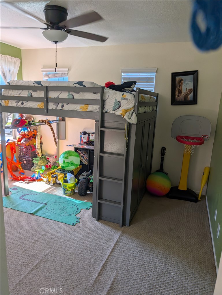 7397 McClellan Court Fontana, CA 92336 - Photo 14 of 14 a kitchen with refrigerator and window