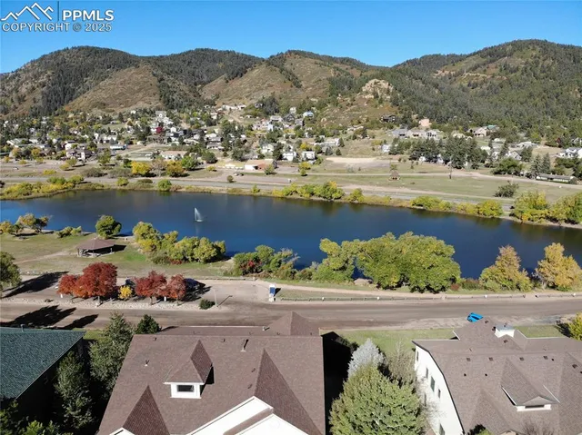 an aerial view of a house with a lake view