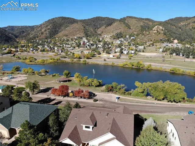 an aerial view of a house with a lake view