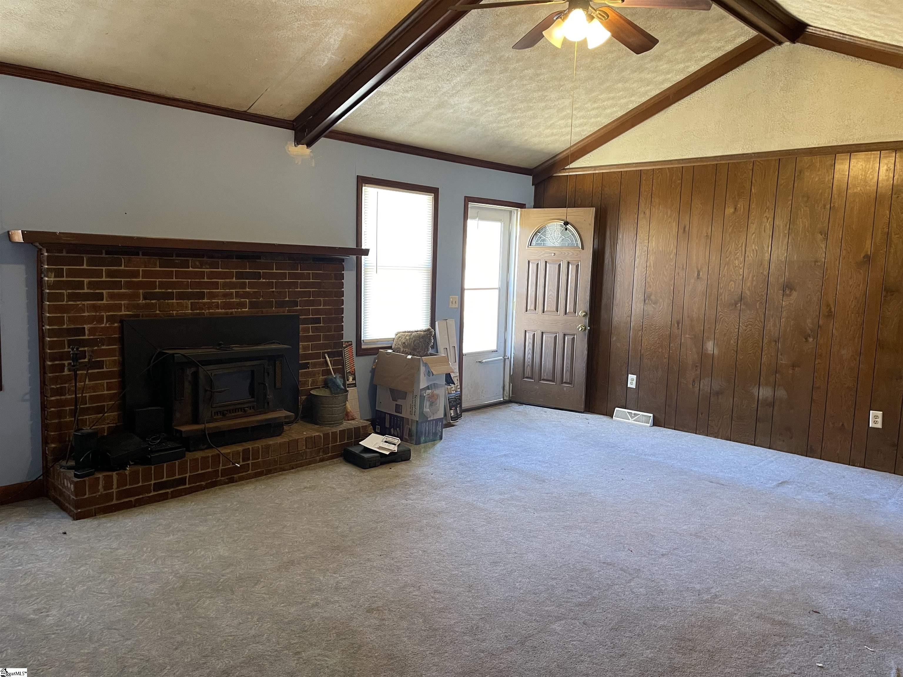 222 Ashmore Bridge Road Mauldin, SC 29662 - Photo 4 of 13 Great Room has cathedral ceiling, brick fireplace and wood burning stove insert.
